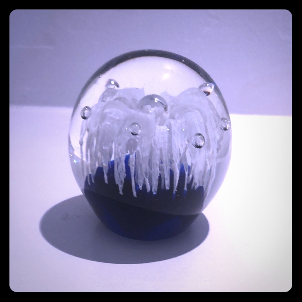 Glass paper weight w/controlled bubbles.